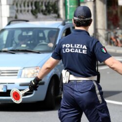 Italian Policeman in Uniform Controlling Road Traffic in The Cit