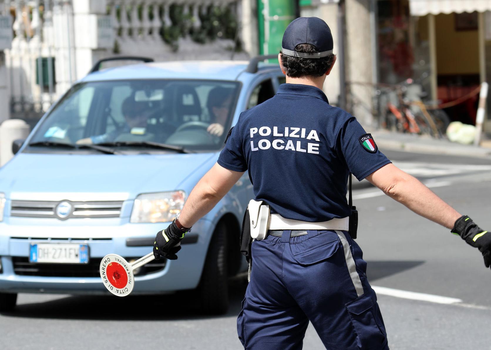 Italian Policeman in Uniform Controlling Road Traffic in The Cit